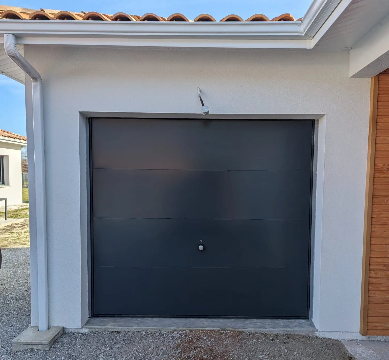 Après-intervention sur porte de garage.