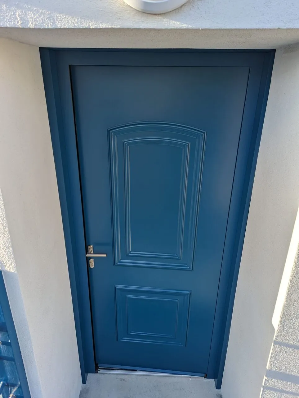 Après-intervention sur portée d'entrée de maison.